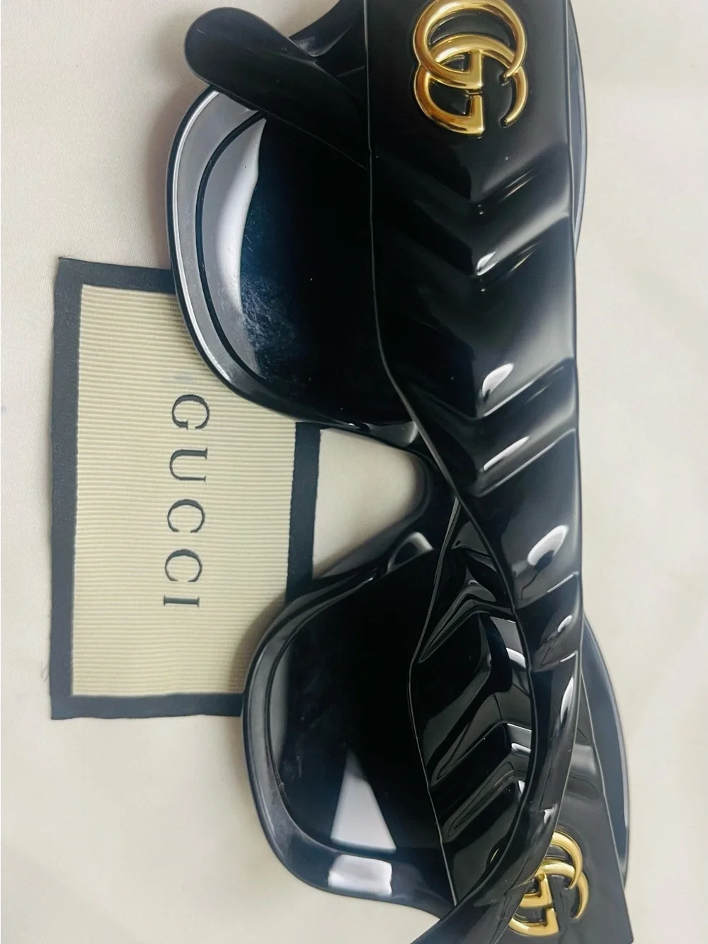 Gucci Black Round Sunglasses with Gold GG Emblem